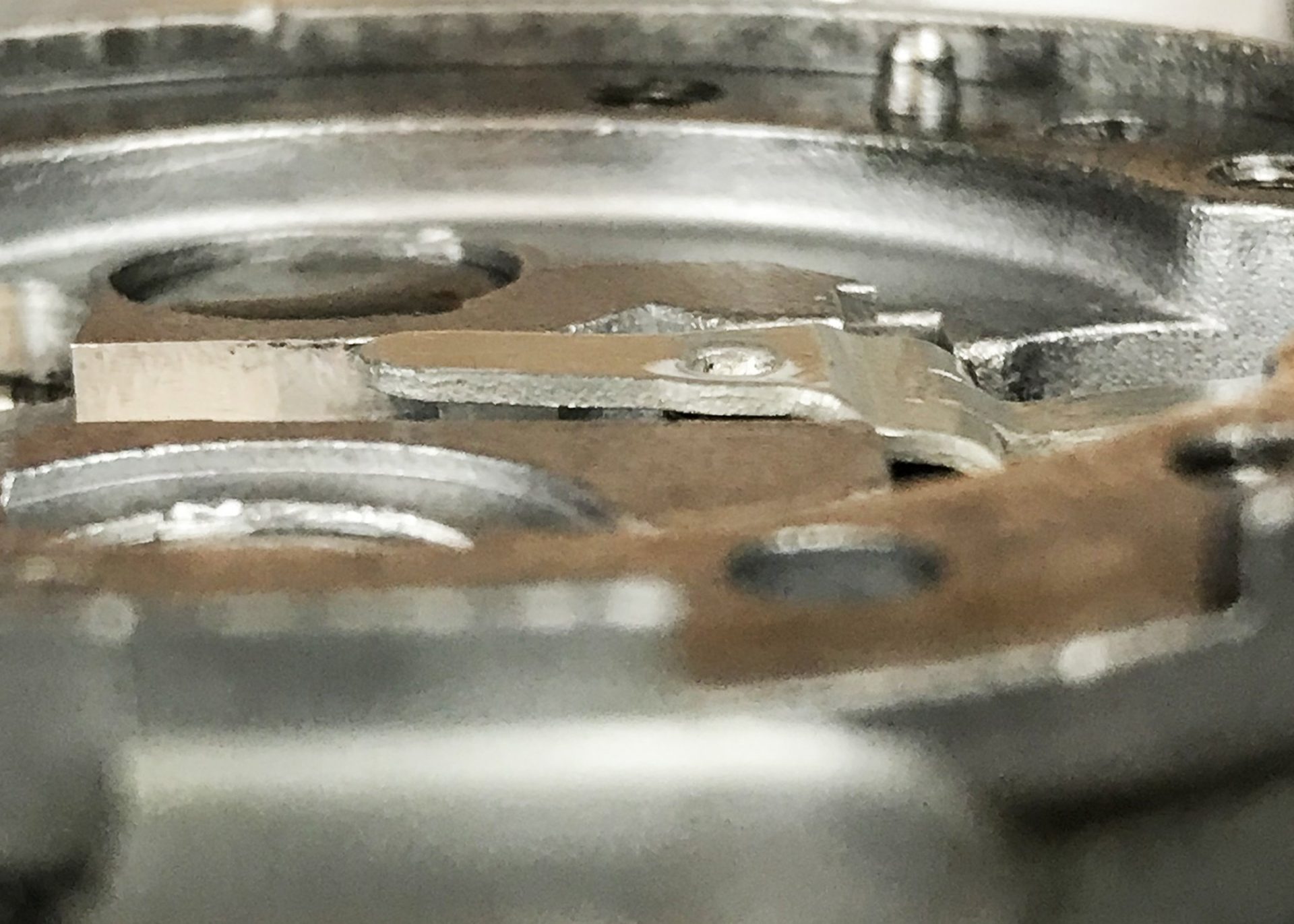 PO-11 Fulcrum lever height plays a role in determining a carburetor’s inherent richness or leaness. Level with the surrounding “flats” is kind of the neutral position. This lever is actually raised .040” above the carb body for a richer mixture.