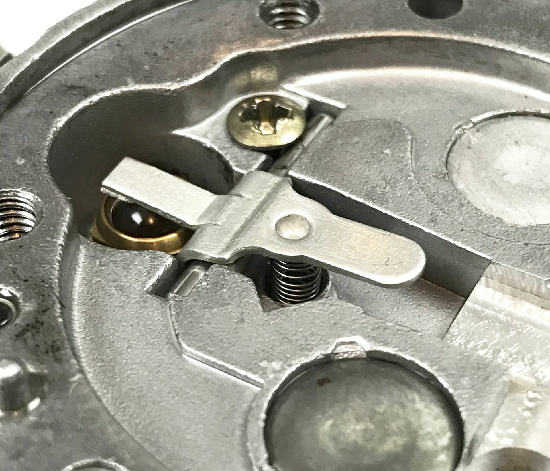 PO-2 After you remove the pumper stack, what you see is the “brain” of the carburetor, the fulcrum arm/inlet seat assembly. It’s hard to believe, but this crude little lever spring arrangement operates at engine rpm, or in my case 15,000.
