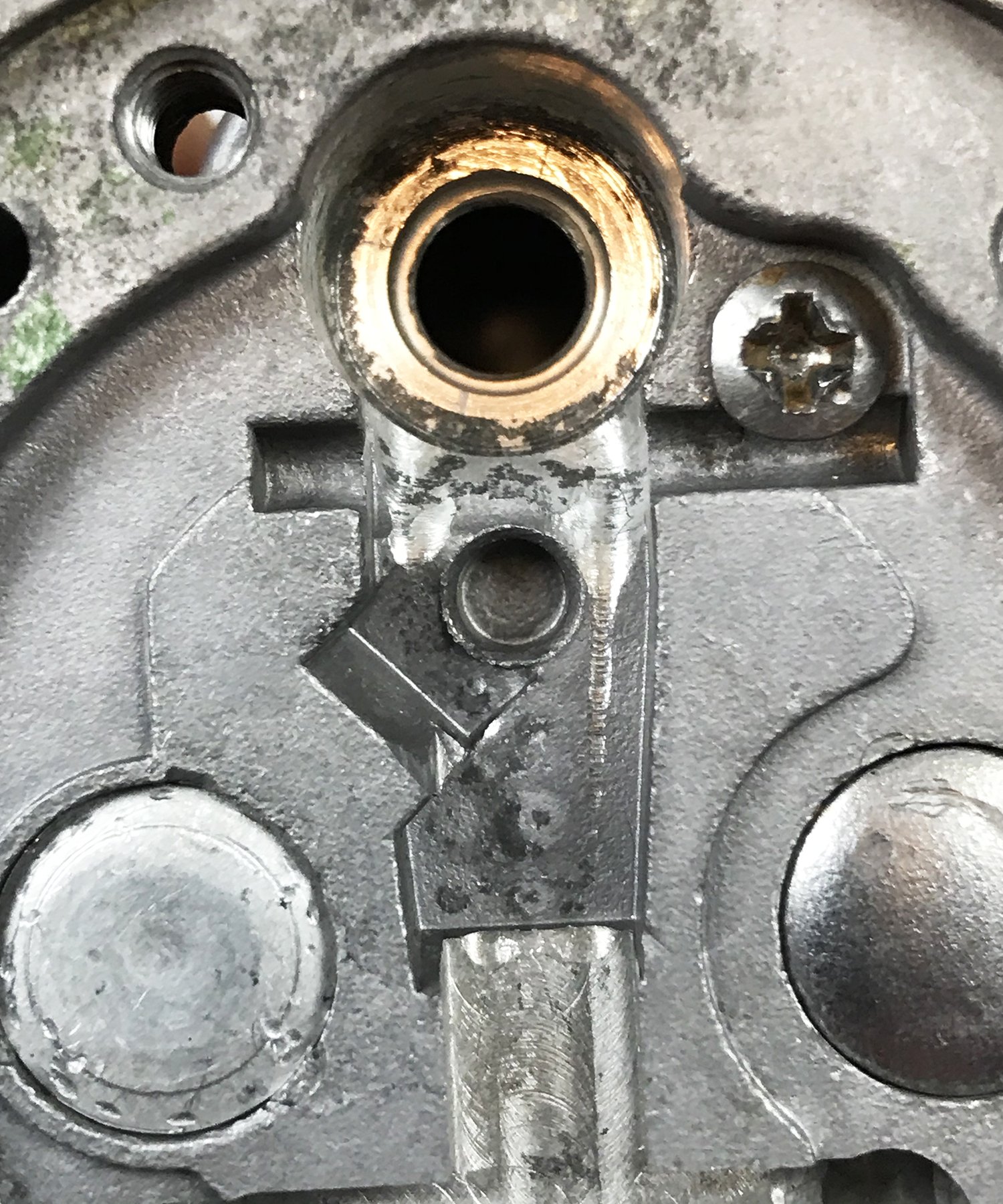 PO-9jpg If you noticed leaking around your inlet valve during pop-off testing, or the inlet valve just wouldn’t build to a pop-off pressure, there’s a good chance it is leaking under its seat. As you can see the debris in my second carb here that was allowing the gross jet assemble to leak by it completely. I cleaned it with a small screwdriver and added a fiber washer.