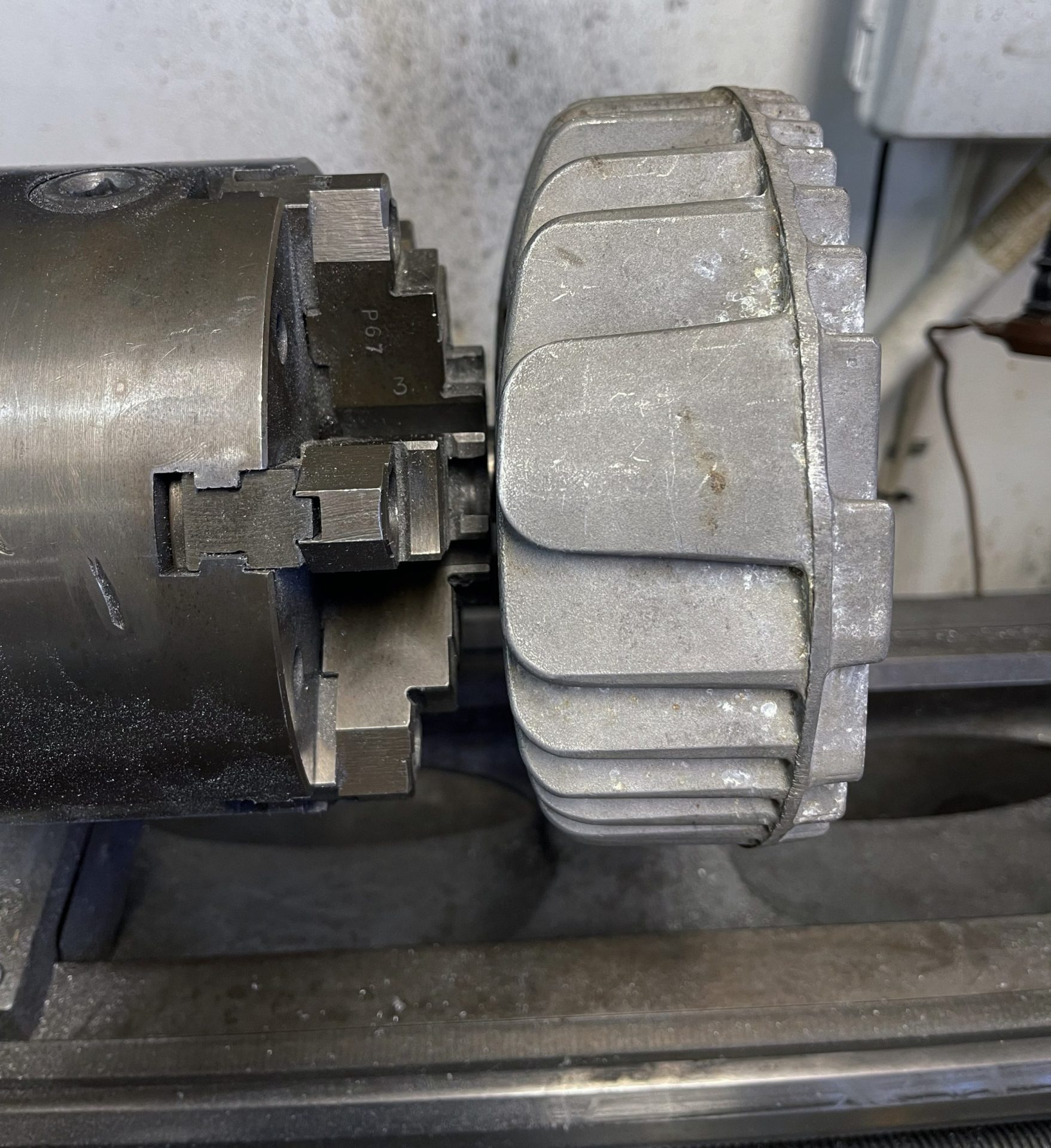 Step4 The mandrel should stick out of the lathe chuck or collet just enough to screw on the head and clear the fins. This provides the least amount of runout for accurate machining.