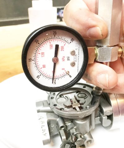 To check the pop-off pressure, slowly pump up the gauge until the inlet valve releases the pressure. This carb popped-off at around 6psi and held at 3.5psi, which was perfect for methanol fuel.