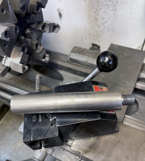 Here is the LAD cylinder head mandrel. It fits into the lathe chuck or collet and then the head screws on to the mandrel via the sparkplug threads.